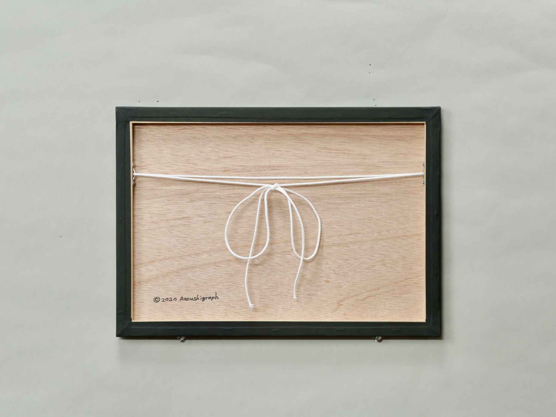 Atsushigraphの木製パネルジークレー版画 Trustの裏面の画像です。